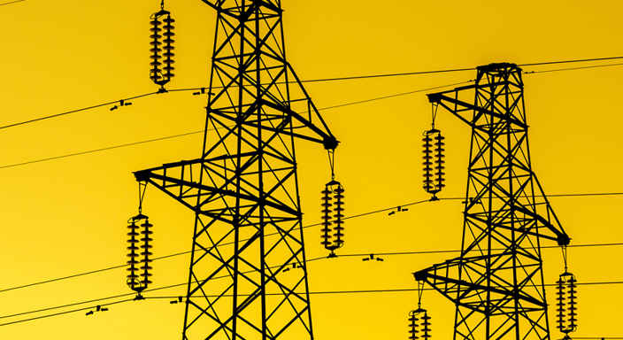 Elstolpar mot gul bakgrund